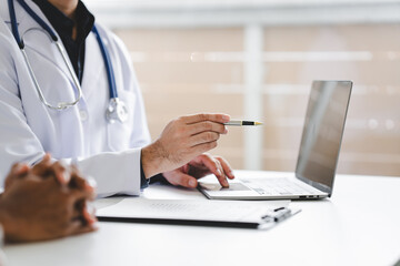 Doctor talking to patient and filling patient history, examination, treatment, medical and health concept..