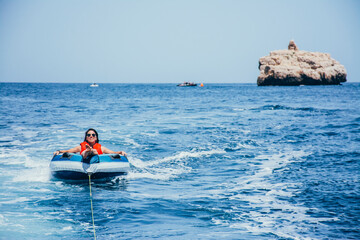 Woman enjoying surfing the sea water