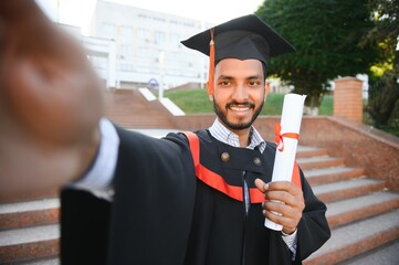 indian male graduate taking selfie