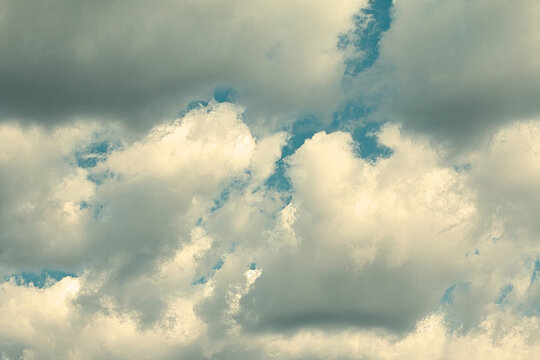 Cumulus clouds full of rain in a summer sky in the mountainsClouds in the summer
