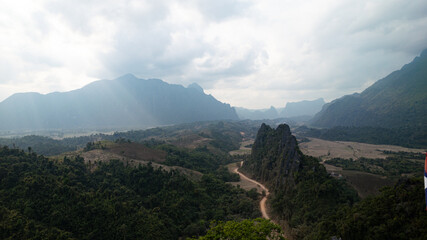 Landscape Panorama view from the mountaintop at Vang Vieng, Laos looks stunning during the moments close to sunset.
