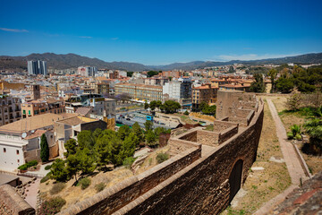 Walls of Alcazaba fortification in Malaga over old city downtown