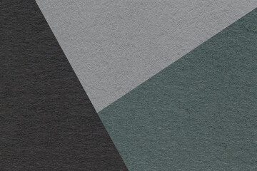 Texture of craft black, teal and gray shade color paper background, macro. Structure of vintage abstract cardboard