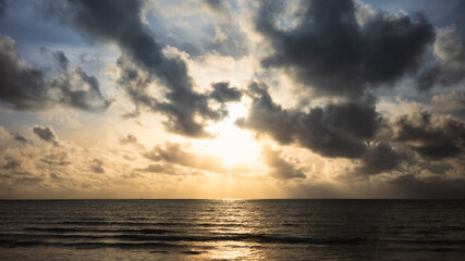 Dramatic sunlight before the horizon at the sea