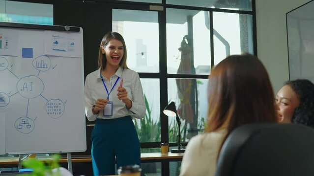 In the meeting room, the young and beautiful businesswoman confidently presented her project to the team, expertly explaining the data research behind it and impressing everyone with her insights.