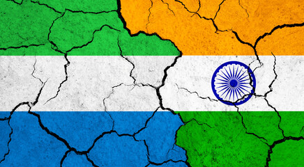 Flags of Sierra leone and India on cracked surface - politics, relationship concept