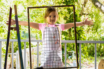 Obraz premium Young artist girl playing with colorful water color paint in art school