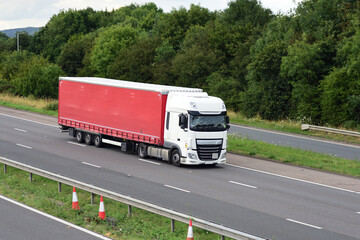 Lorry truck with large trailer on the road