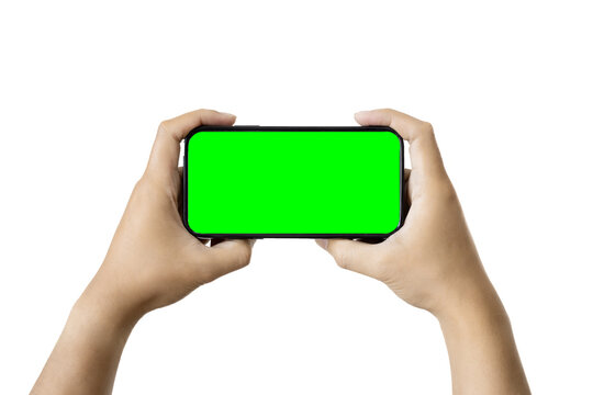 a black phone in hands with green screen on transparent background. PNG format image.