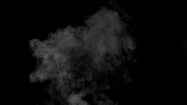 White smoke,steam on a black background. Slow motion. Shot in 4K resolution at 60fps.
