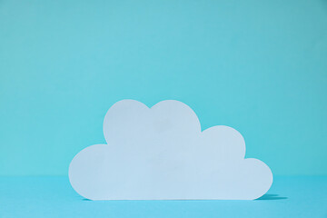 White paper cloud on a blue background, cloud computing concept