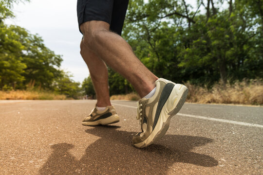 The concept of running on a path, legs close-up