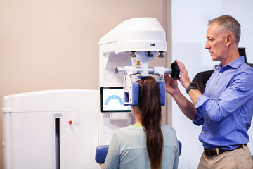 Copy space beside physiotherapist working with patient using physio exercise machine