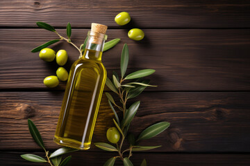 Olive oil and olives berries are on the wooden table under the olive tree.