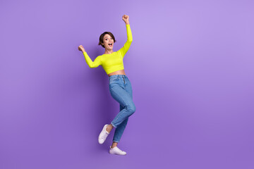 Fototapeta na wymiar Full length body cadre photo of funky crazy girl awesome victory fashion project proposition fists up isolated on purple color background
