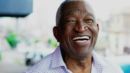 One joyful black older Brazilian person smiling. Charismatic Elderly African American close-up face with friendly disposition