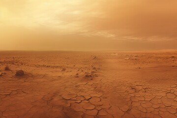 Wide panorama of barren cracked land with sun barely visible through the dust storm