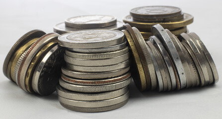 Silver coins from different countries and times - standing coins and coin towers, macro