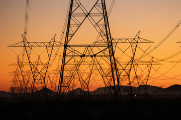 High voltage electric power lines at sunset near Phoenix, Arizona, USA