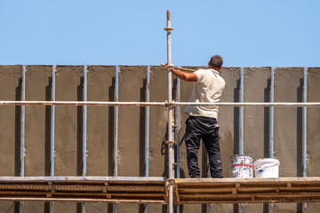 Workers on scaffolding at a construction site