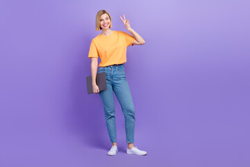 Fototapeta premium Full size body photo of blonde bob hair girl victory symbol two fingers new worker office hold laptop isolated on violet color background