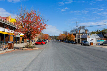 Blue sky on sunlit autumn day showing main street of country town scene in Gunning, New South Wales