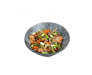 A bowl of udon noodles, veal and fried vegetables angle view on transparent background