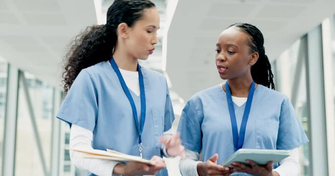 Doctor, women together and report in corridor for results, analysis or discussion for healthcare in clinic. Medic team, documents and advice in hospital for strategy with information, review or admin