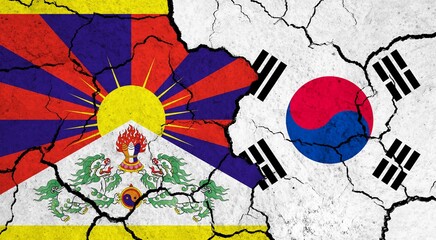 Flags of Tibet and South Korea on cracked surface - politics, relationship concept