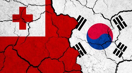 Flags of Tonga and South Korea on cracked surface - politics, relationship concept