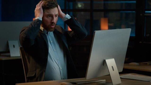 Frustrated stressed businessman work in evening office Caucasian middle-aged man fail lose online project on computer lost business bankruptcy failure lost job desperate anxious male losing problem