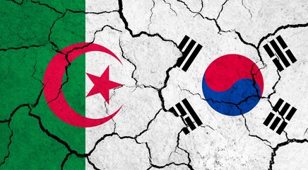 Flags of Algeria and South Korea on cracked surface - politics, relationship concept