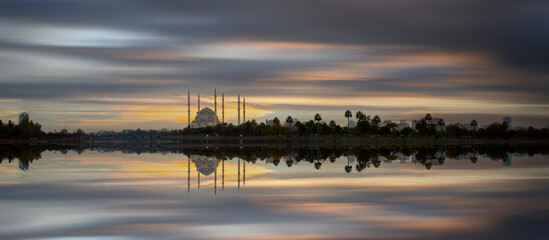 Sabanci Central Mosque, Old Clock Tower and Stone Bridge in Adana, city of Turkey. Adana City with mosque minarets in front of Seyhan river.