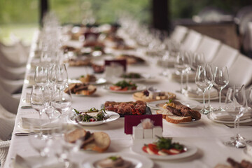 Catering service. Restaurant table with food. Huge amount of food on the table. Plates of food....
