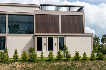 Close-up view outside corner of brown modern house building.