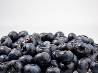 Ripe blueberries on a light background. blueberries close up
