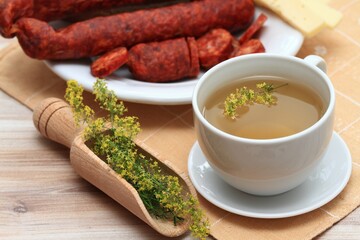 Herbal tea from herb Galium verum, also known as  lady's bedstraw or yellow bedstraw and sausage. Traditional medicinal herb reduces appetite and  helps to lose weight.