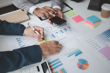 Atmosphere of a startup company meeting, business people are meeting together to summarize and plan investment finances, they are the founders of the company. Business administration concept.