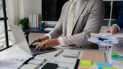 Company employees are doing stressful gestures due to heavy workload, hard work, businessman with a lot of documents. The concept of hard work of company employees. © PHOTO4U