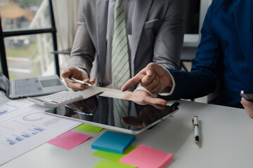 The sales department is having a monthly summary meeting to bring it to the department manager, they are verifying the correctness of the documents that are prepared before bringing in to the manager