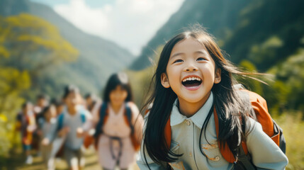 Naklejka premium Back to school concept. Portrait of asian school girl with backpack in school environment.