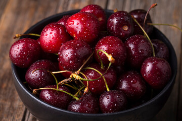 Fresh organic cherries on wooden background