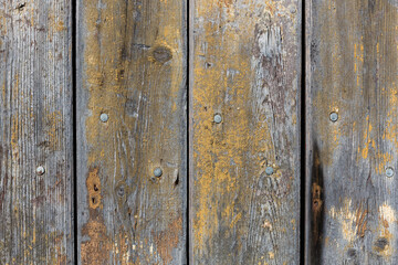 wooden background with weathered wood and ruusty nails