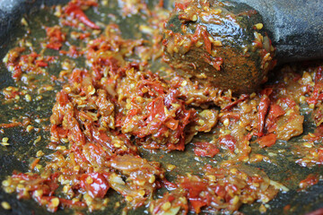 Sambal is an Indonesian chilli sauce or paste, made from red chili pepper and onion, mashed by stone mortar and pestle.