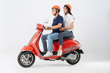 Fototapeta na wymiar image of asian couple riding scooter on white background