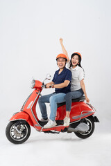 image of asian couple riding scooter on white background © Q88