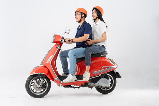 image of asian couple riding scooter on white background