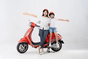 Foto op Plexiglas mother and son wearing helmets and riding motorbikes © 1112000