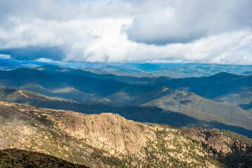 Mount Buffalo National Park, Victoria. Australia. Australian Alps views from The Horn picnic area. Mountains and clouds scenic view