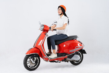 Fototapeta na wymiar full body photo of a woman wearing a hairdresser and driving a motorbike